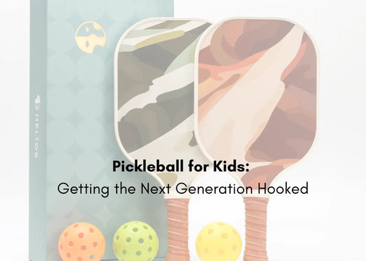 Kids playing pickleball with child-sized paddles on an outdoor court