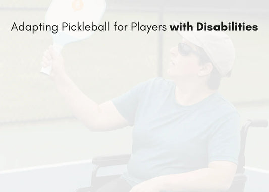 Wheelchair athlete playing pickleball with adaptive paddle on a court
